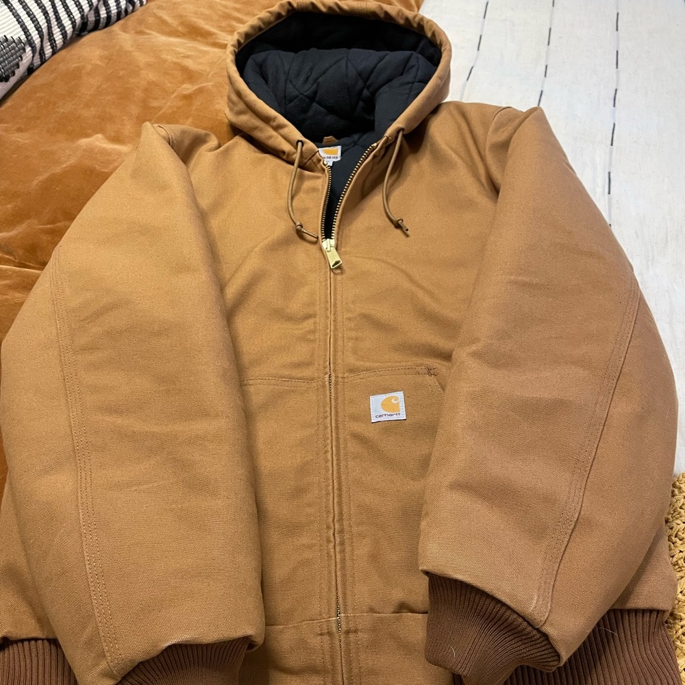 Mens Carhartt hooded jacket size medium tall. Never worn, no blemishes.